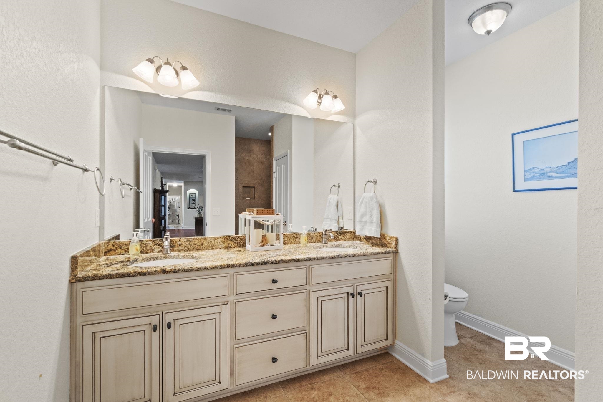 8664 Foxtail Loop Pensacola, FL 32526 - Photo 27 of 64 Bathroom featuring tile patterned flooring, toilet, double vanity, and baseboards