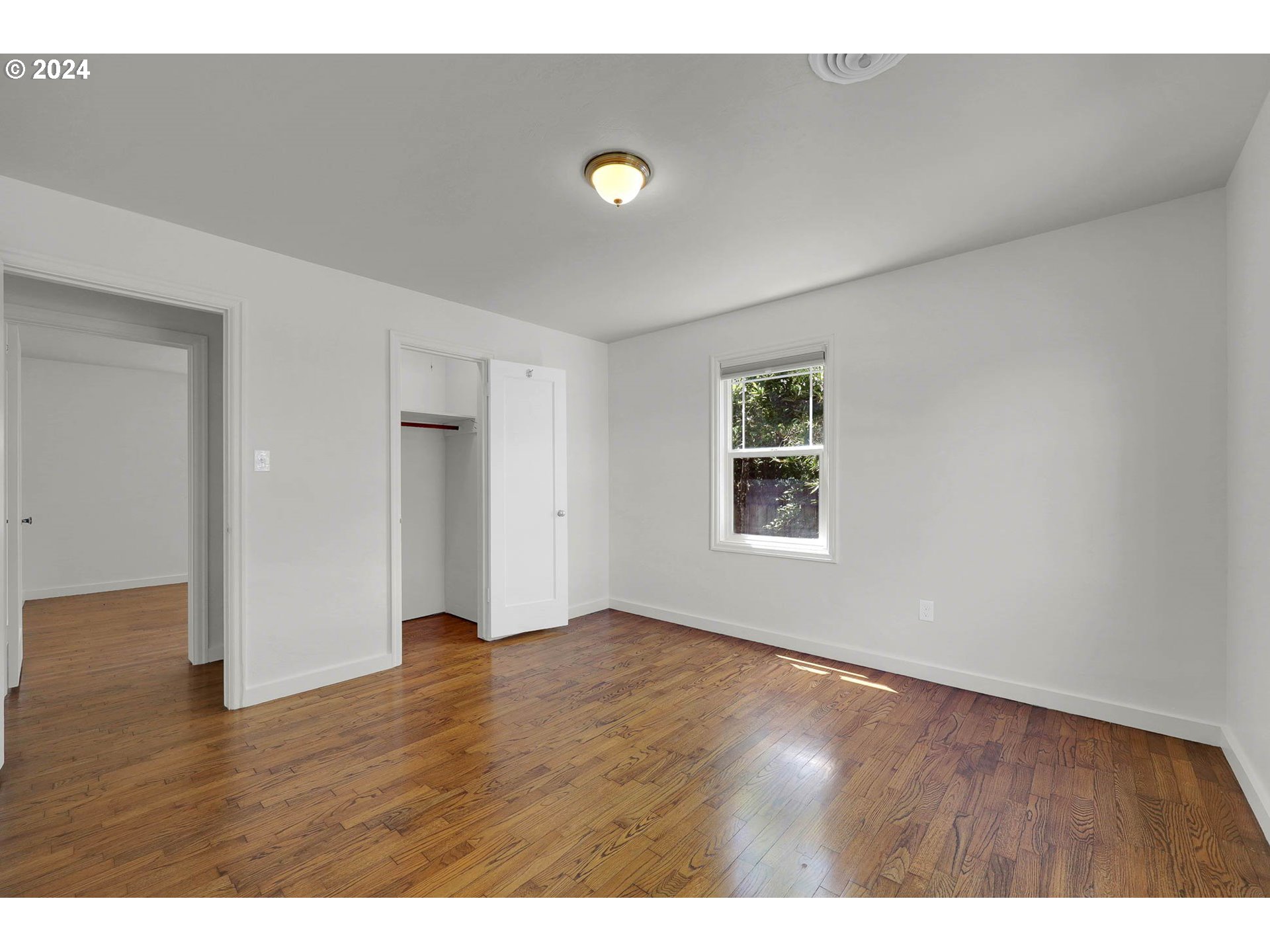 1325 Modoc Street Springfield, OR 97477 - Photo 23 of 36 a view of an empty room with wooden floor and closet