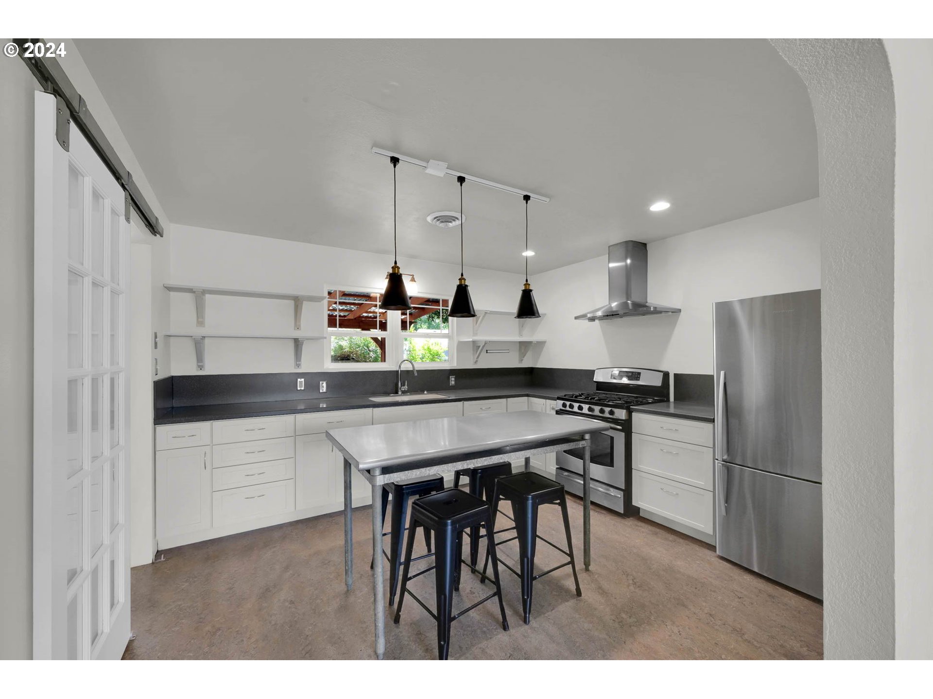 1325 Modoc Street Springfield, OR 97477 - Photo 8 of 36 a kitchen with refrigerator and chairs