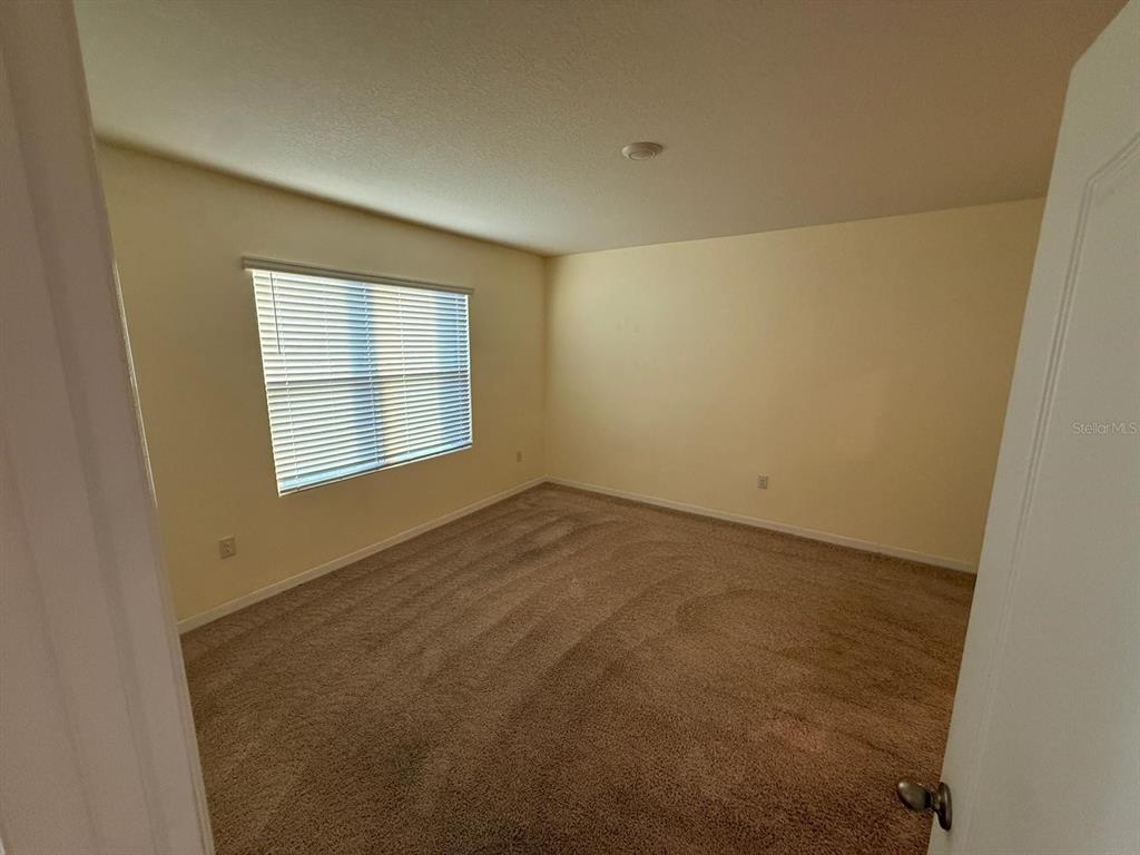 2617 Harmonia Hammock Road Harmony, FL 34773 - Photo 15 of 36 an empty room with windows