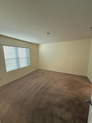 an empty room with a empty space and window