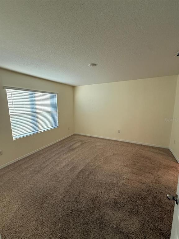 2617 Harmonia Hammock Road Harmony, FL 34773 - Photo 7 of 36 an empty room with a empty space and window