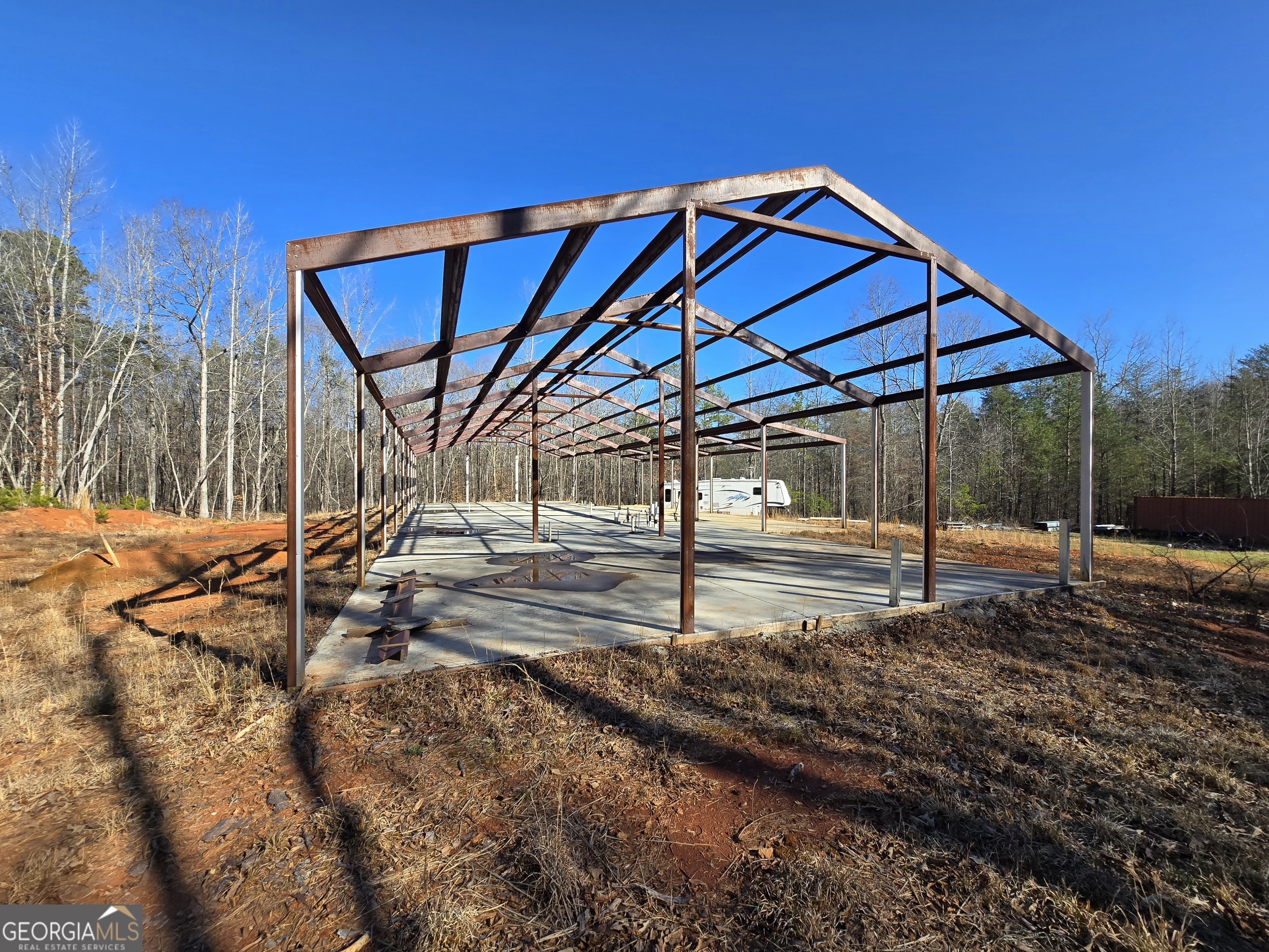 1183 Wilson Bridge Road Homer, GA 30547 - Photo 4 of 23 a view of a house with backyard and sitting area