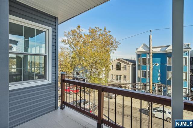 127 Randolph Avenue, Unit 2 Jersey City, NJ 07305 - Photo 16 of 17 a view of a large building from a balcony