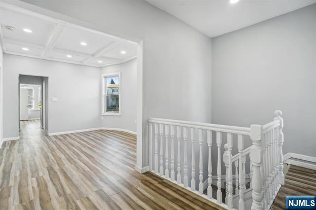 127 Randolph Avenue, Unit 2 Jersey City, NJ 07305 - Photo 5 of 17 a view of hallway with wooden floor