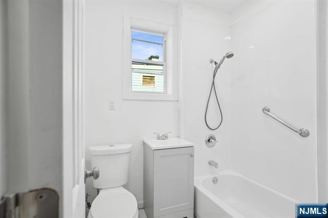 127 Randolph Avenue, Unit 2 Jersey City, NJ 07305 - Photo 7 of 17 a bathroom with a toilet sink and shower