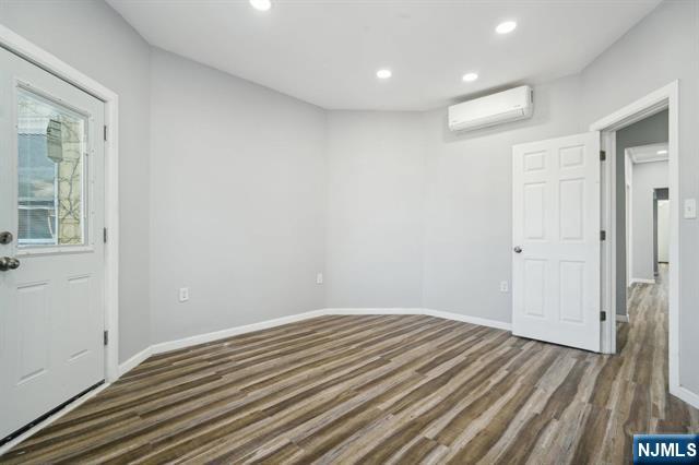 127 Randolph Avenue, Unit 2 Jersey City, NJ 07305 - Photo 9 of 17 a view of a room with wooden floor and bathroom