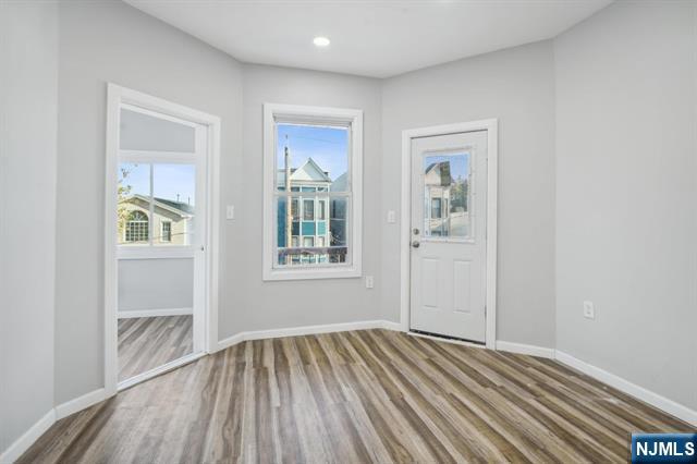 127 Randolph Avenue, Unit 2 Jersey City, NJ 07305 - Photo 10 of 17 an empty room with windows