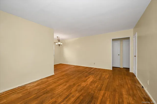a view of a room with wooden floor
