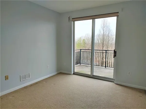 an empty room with sliding door