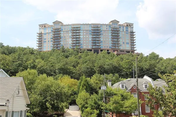 a view of a large building with a yard