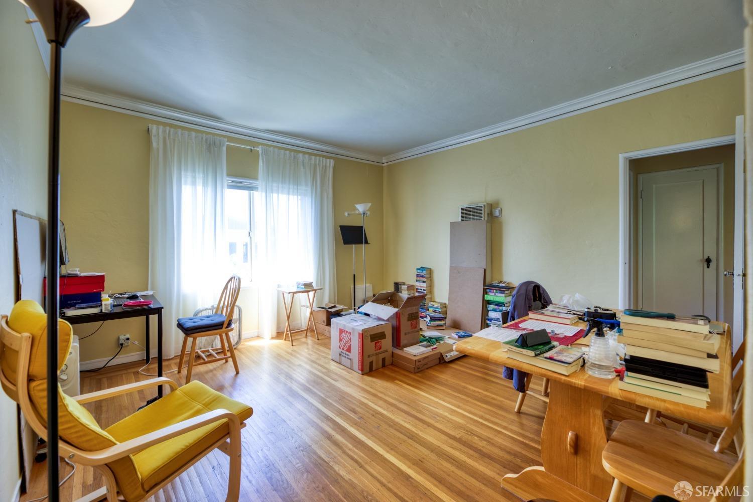 1334-1336 Walnut Street Berkeley, CA 94709 - Photo 14 of 18 a living room with furniture and a wooden floor