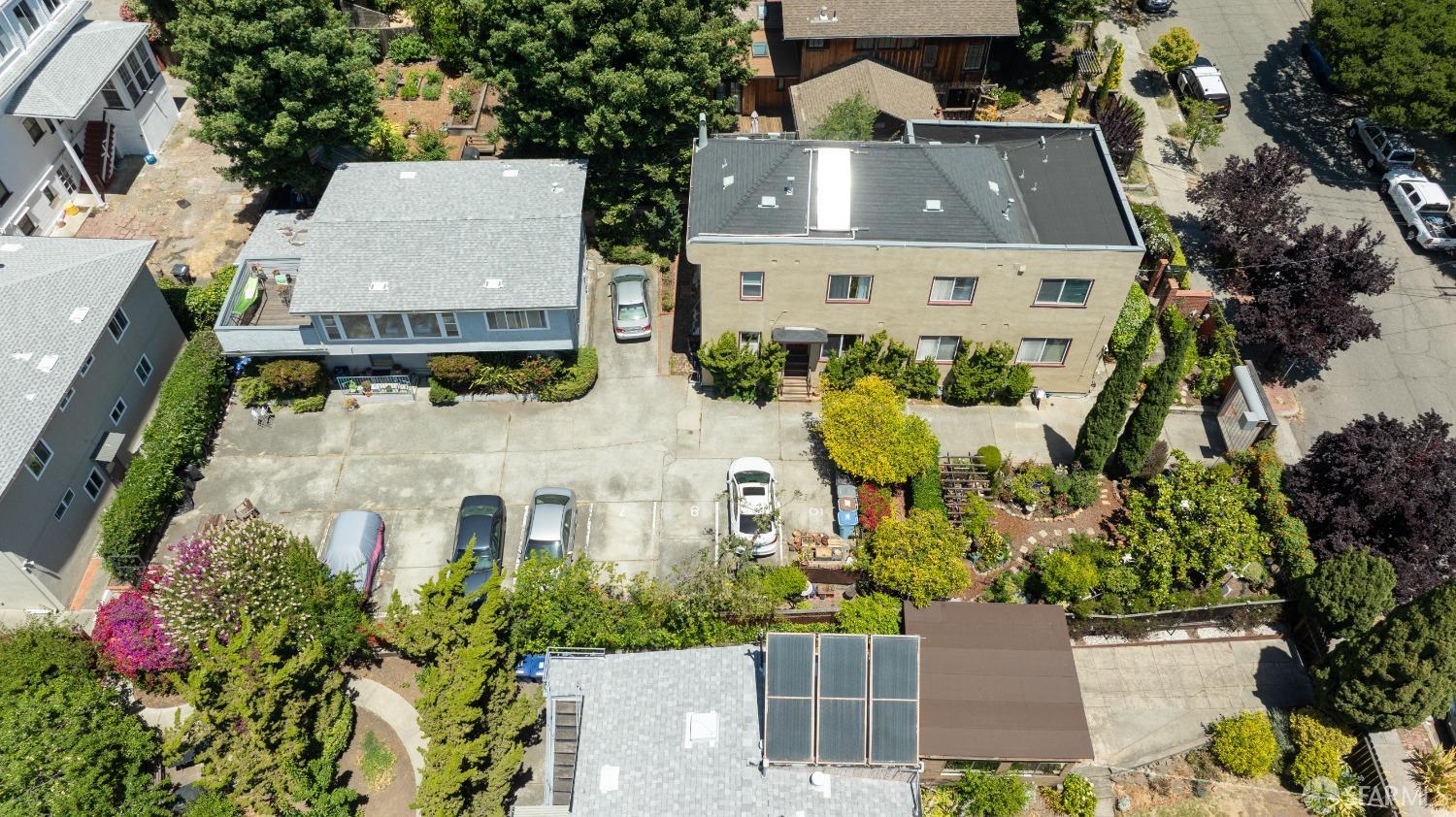 1334-1336 Walnut Street Berkeley, CA 94709 - Photo 5 of 18 an aerial view of a house with a yard and garden