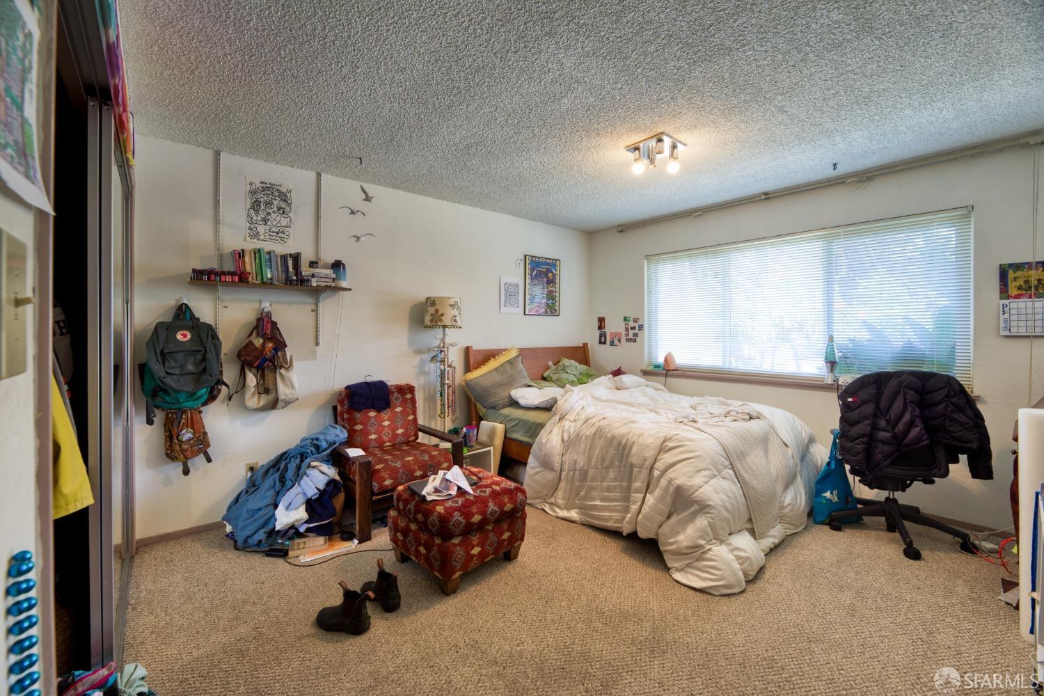 1334-1336 Walnut Street Berkeley, CA 94709 - Photo 10 of 18 a bedroom with bed and a couch