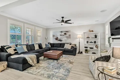 a living room with furniture and a flat screen tv