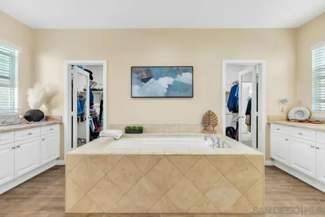 a large white bed in a white room