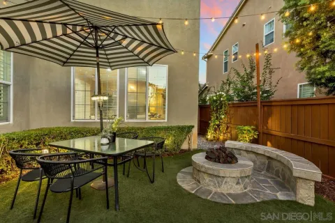 a patio with a table and chairs