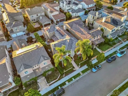 an aerial view of residential house with parking