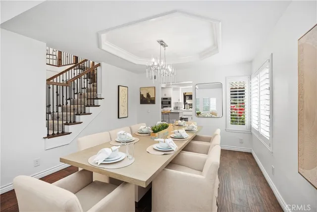a kitchen with stainless steel appliances kitchen island granite countertop a stove and cabinets