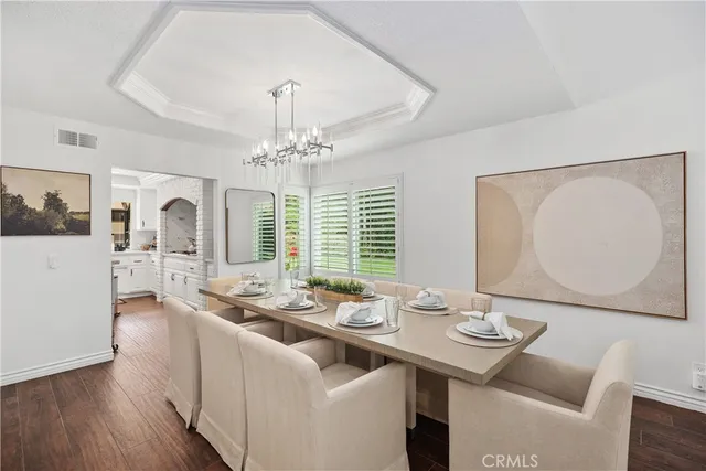 a kitchen with a sink a stove and cabinets