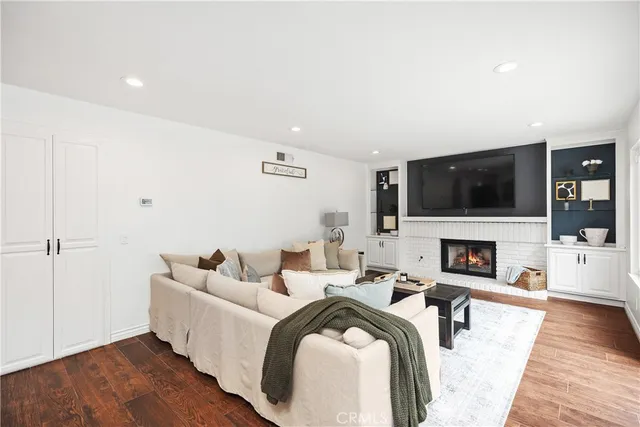 a bathroom with a granite countertop toilet a sink and a mirror