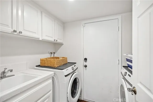 a front view of a house with a garden and patio