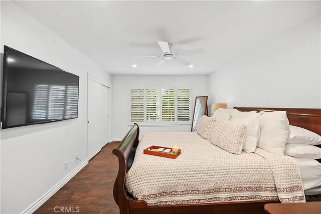 a view of a patio with table and chairs with wooden floor and fence