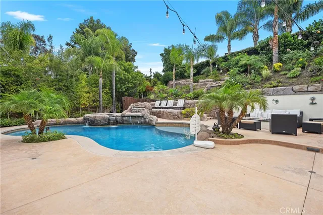 a dining space with furniture and a garden