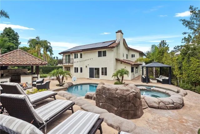 a outdoor living space with patio couch and a table