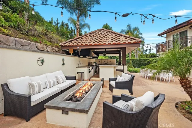 a living room with furniture pool table and a flat screen tv