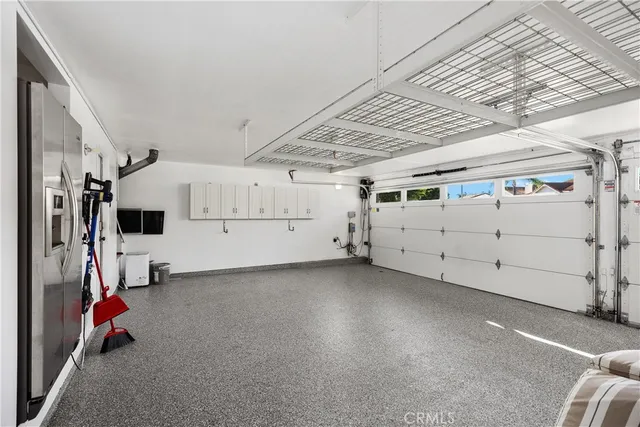 a view of yard with seating area and trees in the background