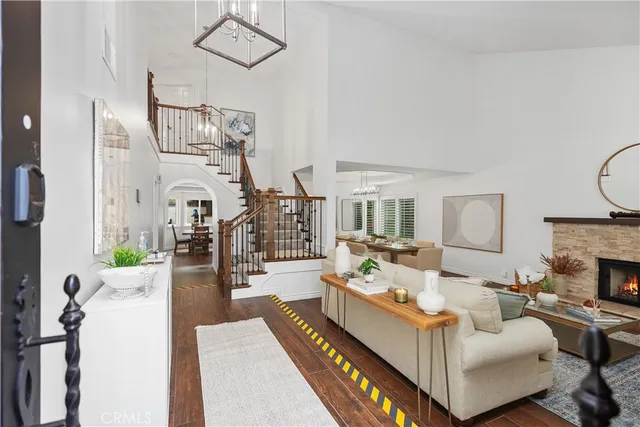 a living room with furniture fireplace and flat screen tv
