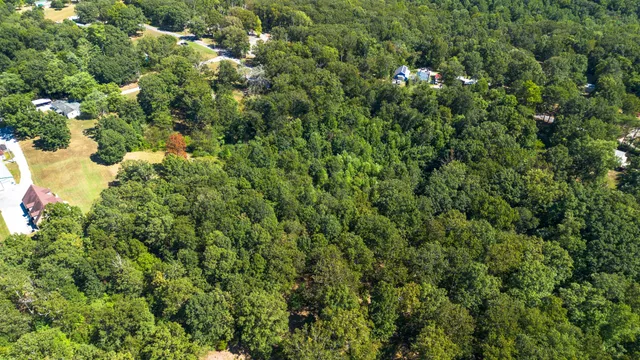 a view of a house with a tree