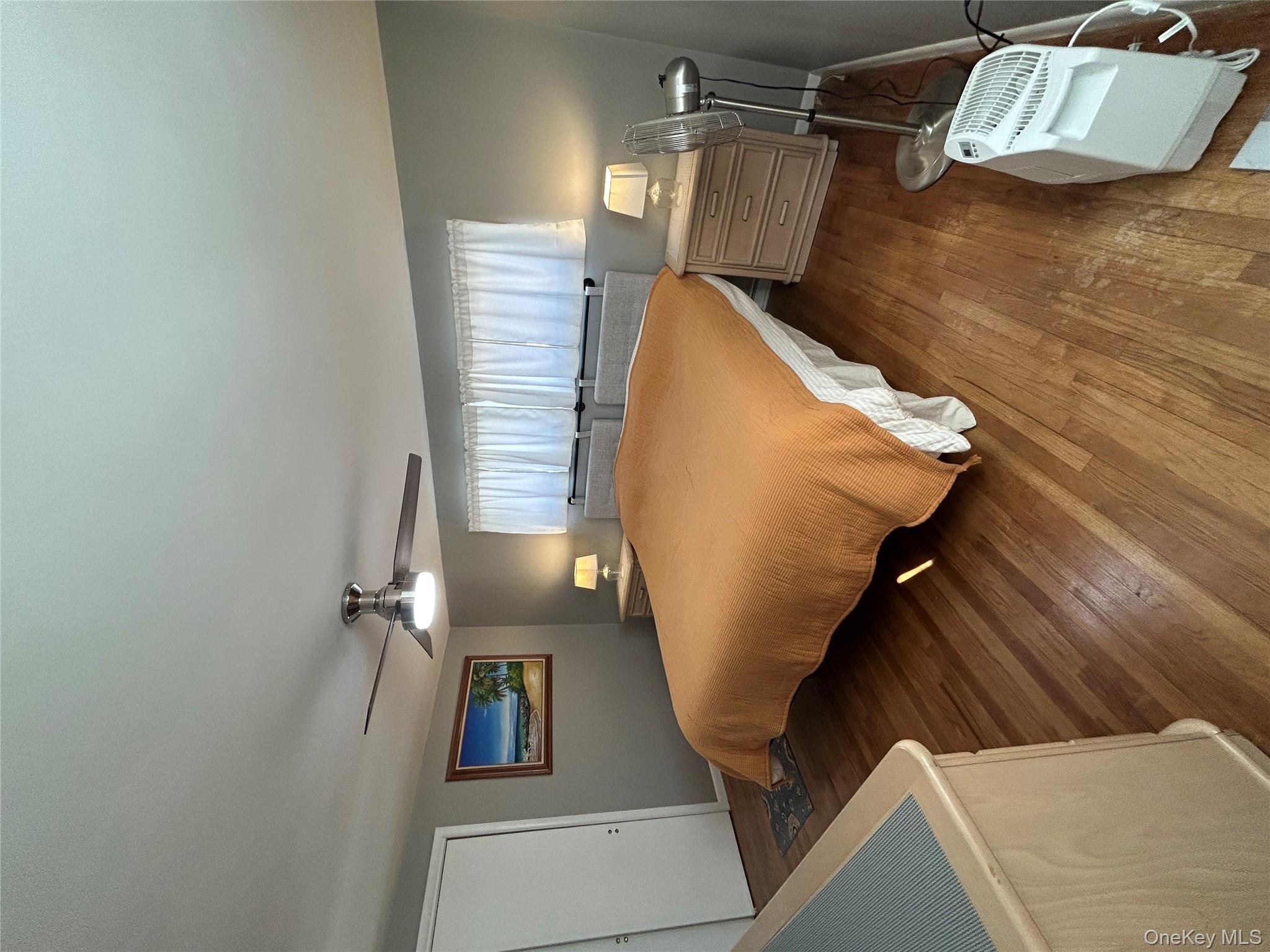 5 Sheldon Drive Cornwall, NY 12518 - Photo 19 of 30 a bedroom with a bed and window