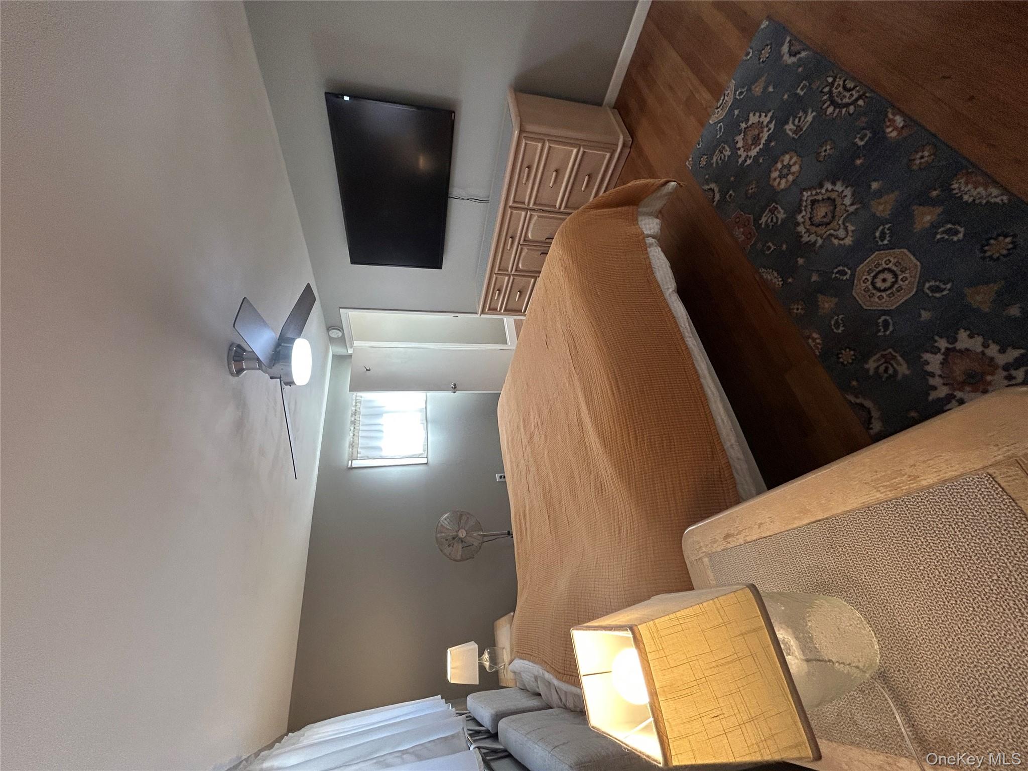 5 Sheldon Drive Cornwall, NY 12518 - Photo 20 of 30 a bedroom with a bed and a flat screen tv