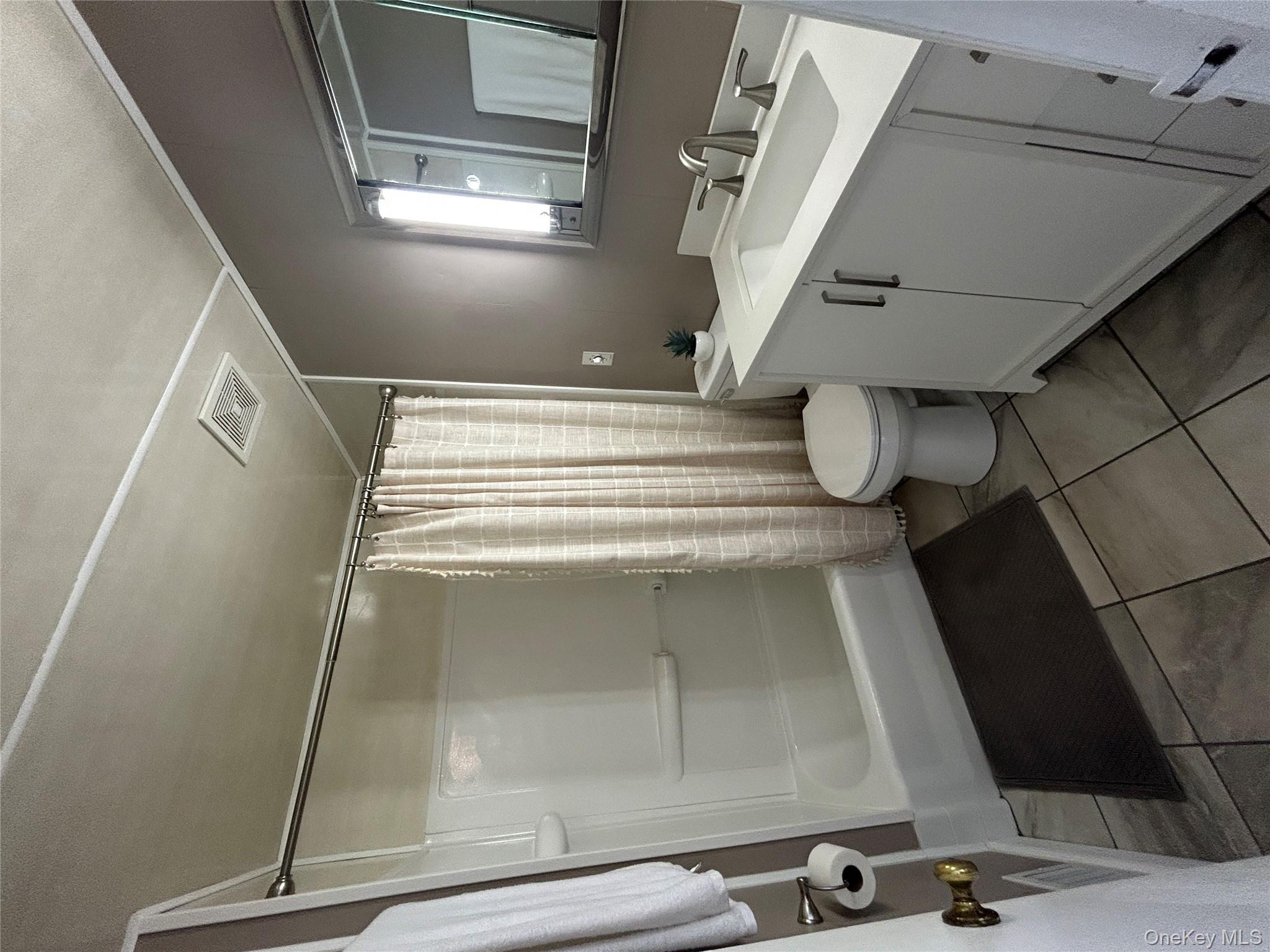 5 Sheldon Drive Cornwall, NY 12518 - Photo 25 of 30 a bathroom with a sink mirror vanity and toilet