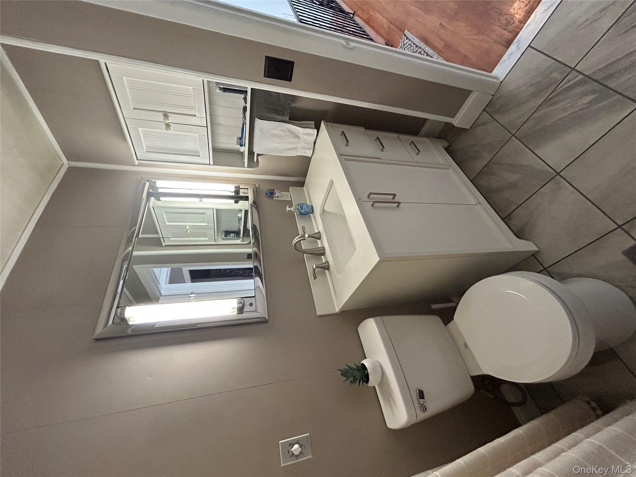 5 Sheldon Drive Cornwall, NY 12518 - Photo 26 of 30 a bathroom with a toilet sink and mirror