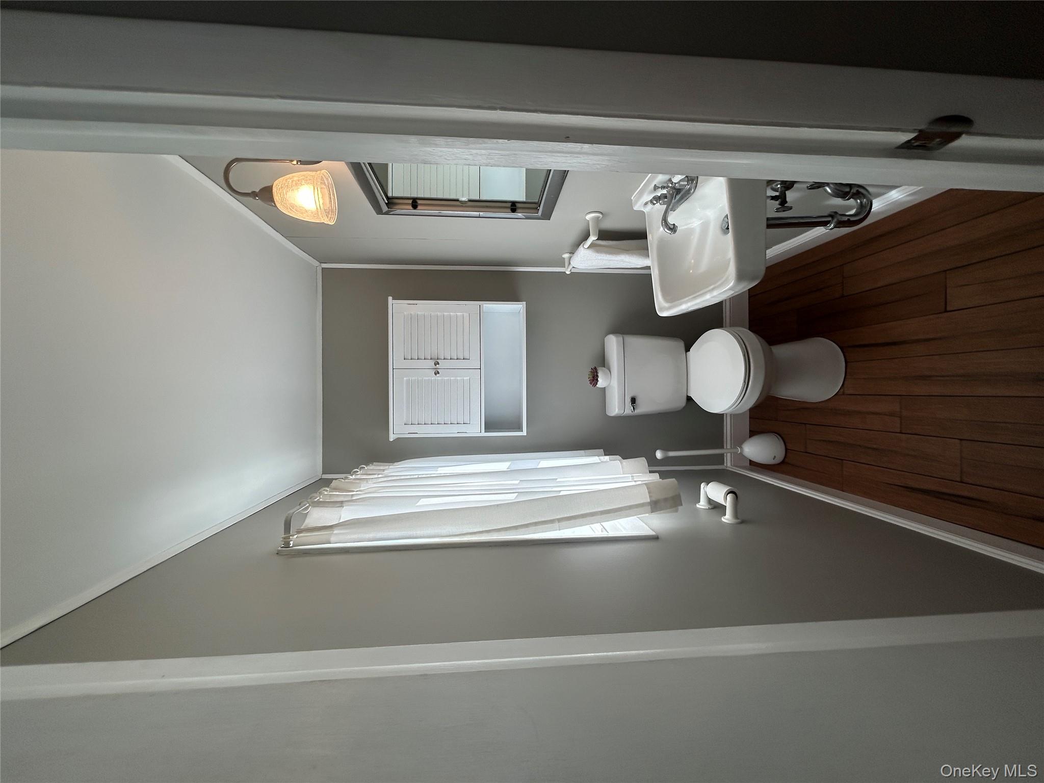 5 Sheldon Drive Cornwall, NY 12518 - Photo 27 of 30 a bathroom with a toilet a sink and mirror