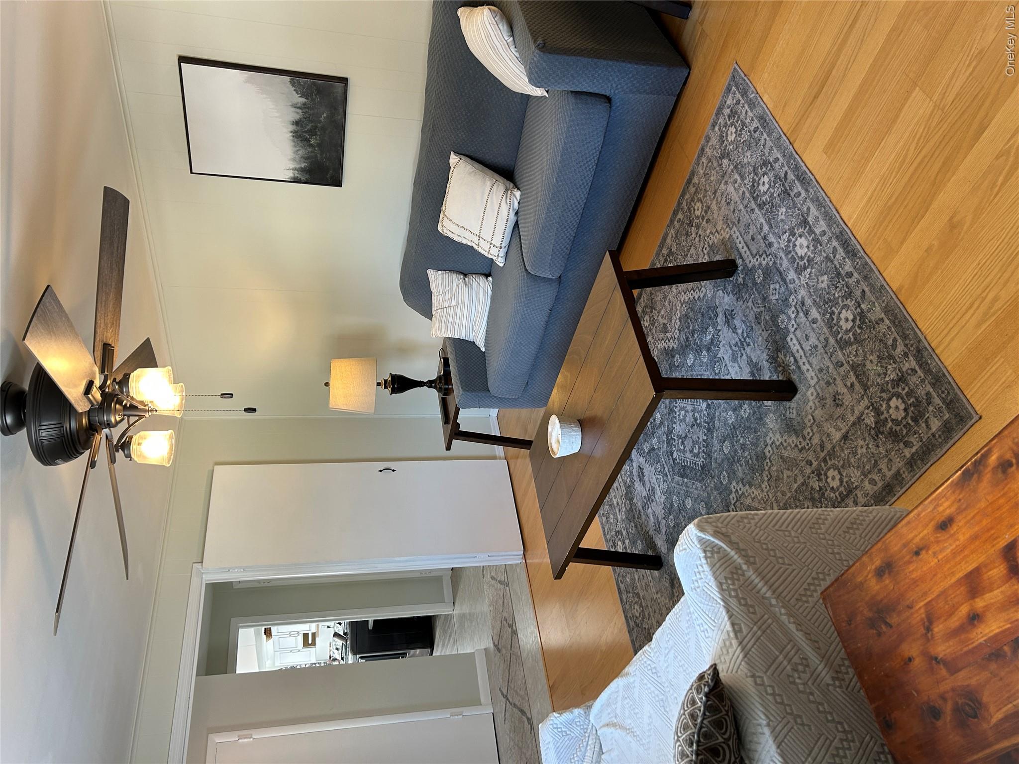 5 Sheldon Drive Cornwall, NY 12518 - Photo 6 of 30 a living room with furniture and a lamp