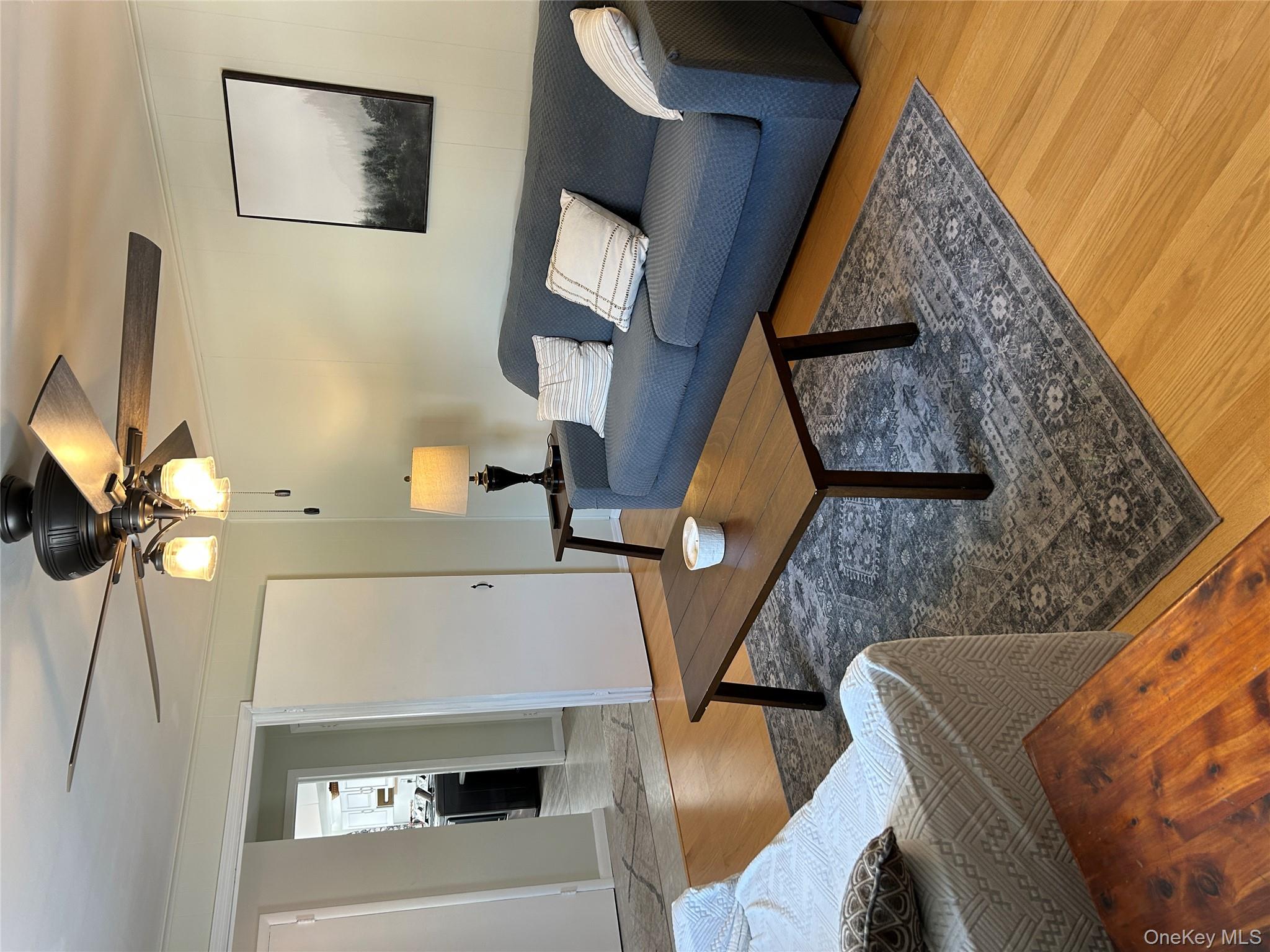 5 Sheldon Drive Cornwall, NY 12518 - Photo 6 of 30 a living room with furniture and a lamp