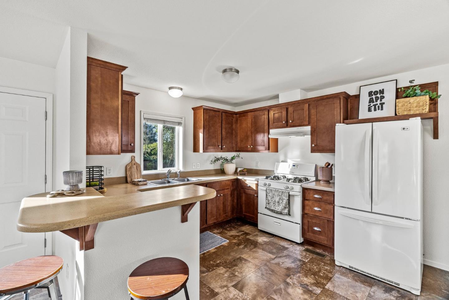 100 North Rodeo Gulch Road, Unit 1 Soquel, CA 95073 - Photo 11 of 20 a kitchen with a sink a stove a refrigerator and a refrigerator