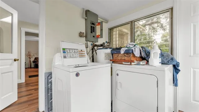 a view of living room with furniture and washer