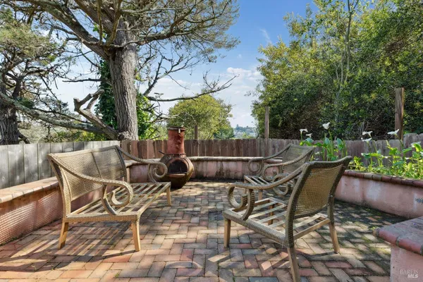 a view of a chairs and table in the patio