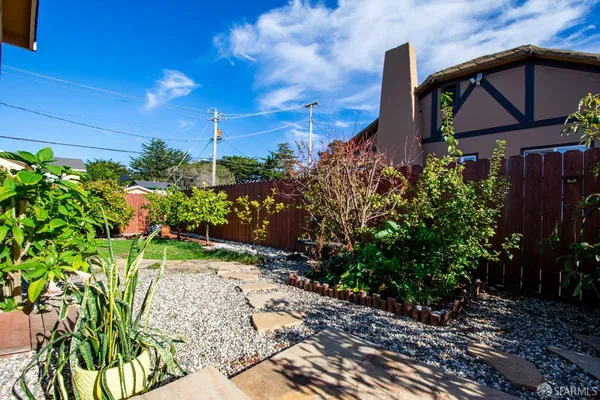 a backyard of a house with lots of green space