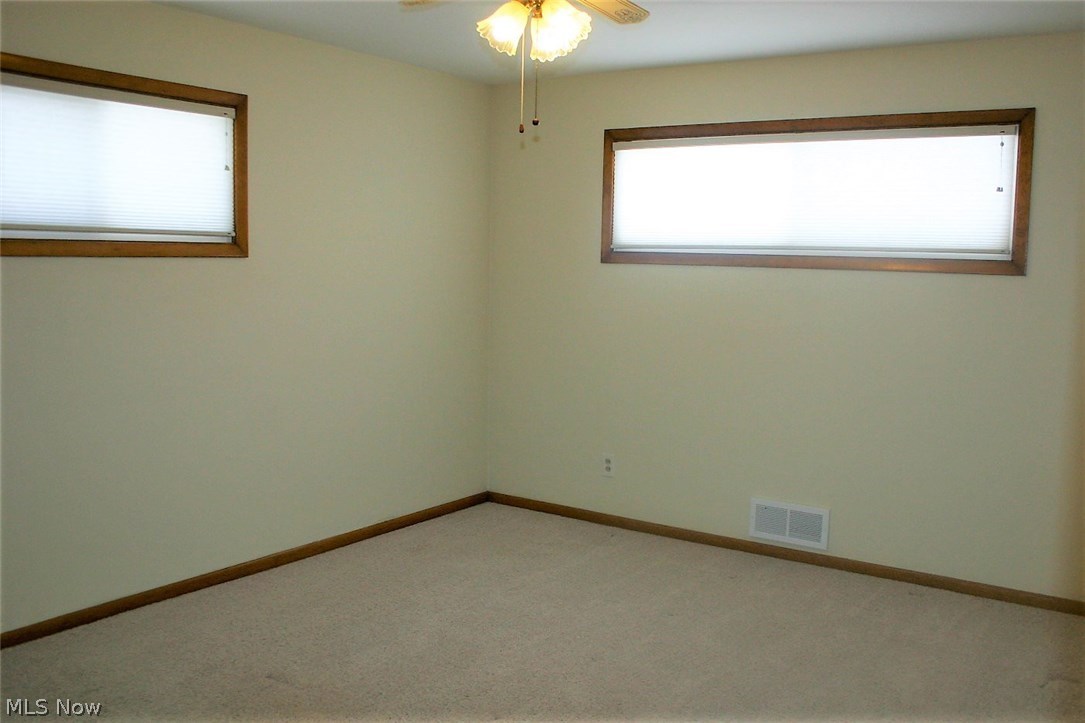 6841 Revere Road Cleveland, OH 44130 - Photo 16 of 31 Master bedroom with newer windows and carpet.