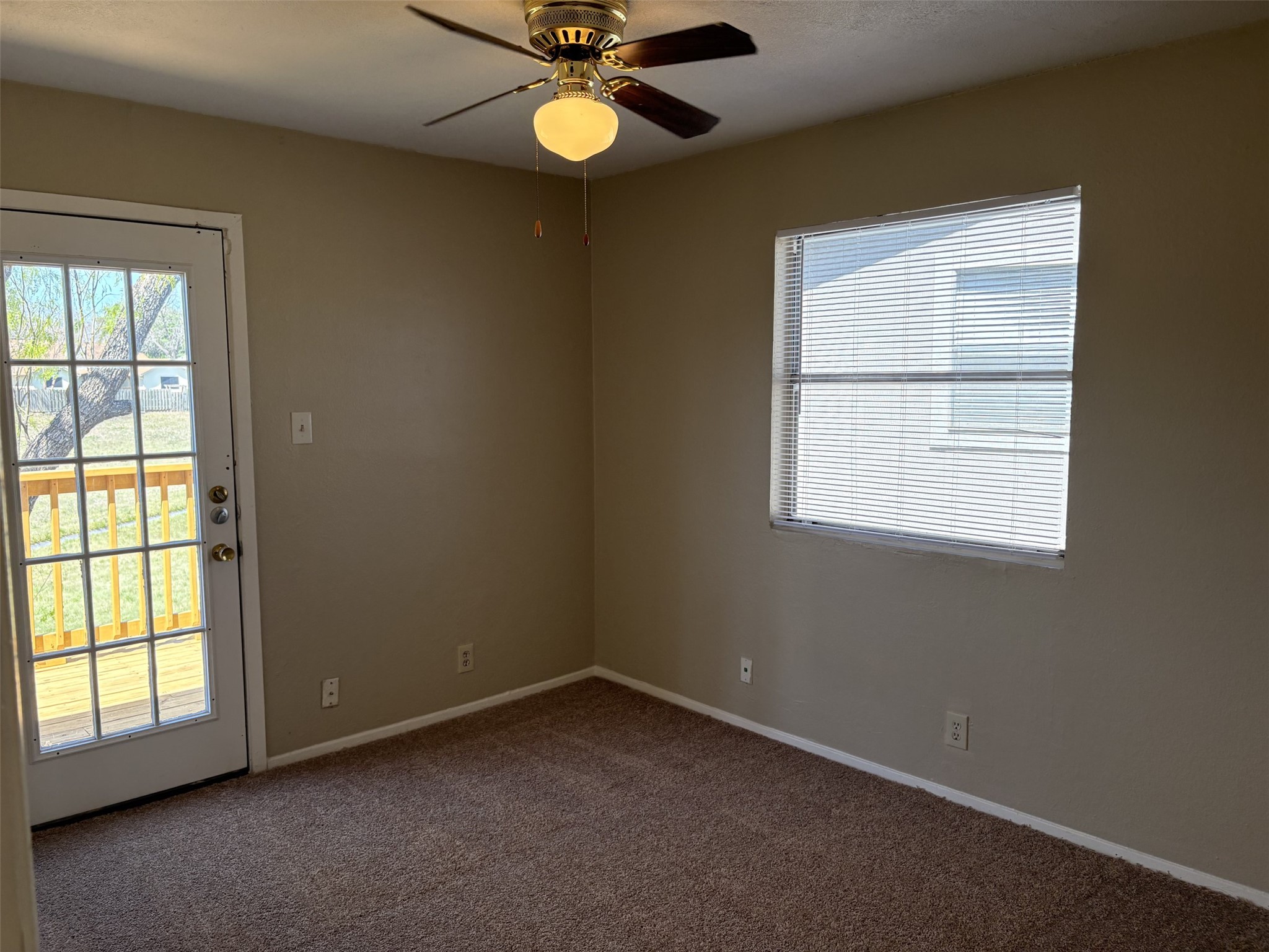 9902 Roxanna Drive, Unit D Austin, TX 78748 - Photo 10 of 19 bedroom featuring carpet, ceiling fan, and plenty of natural light