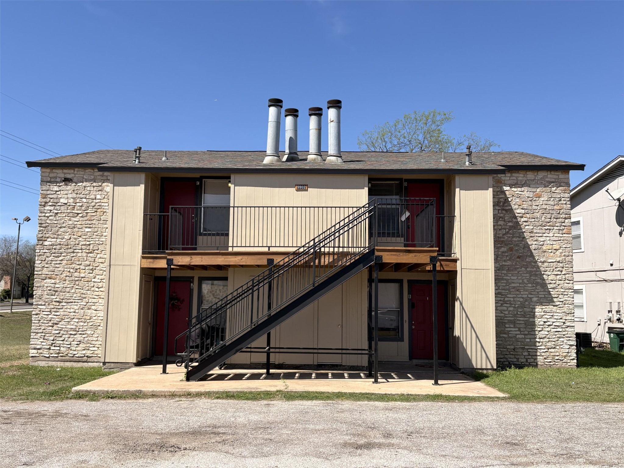 9902 Roxanna Drive, Unit D Austin, TX 78748 - Photo 18 of 19 View of apartment building / complex featuring stairs