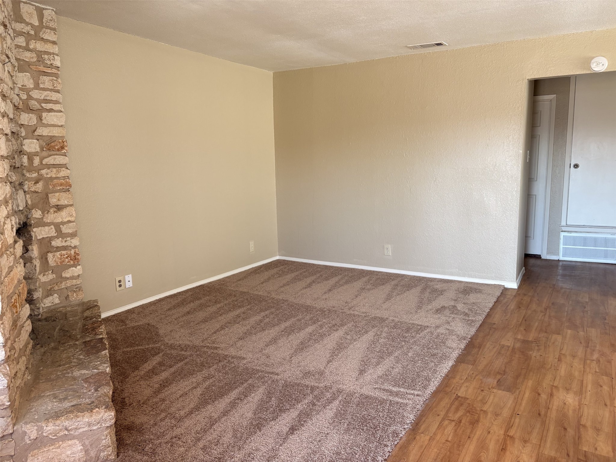 9902 Roxanna Drive, Unit D Austin, TX 78748 - Photo 4 of 19 Living room with dark wood finished floors and carpet