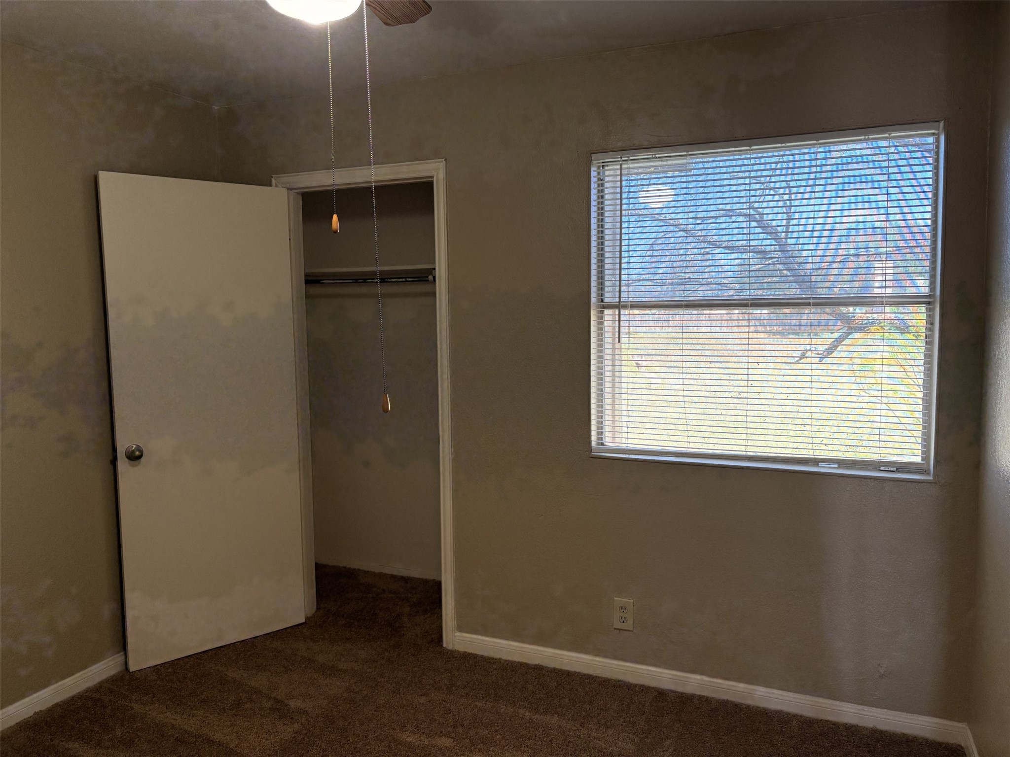 9902 Roxanna Drive, Unit D Austin, TX 78748 - Photo 6 of 19 Unfurnished bedroom featuring carpet, a closet, and ceiling fan