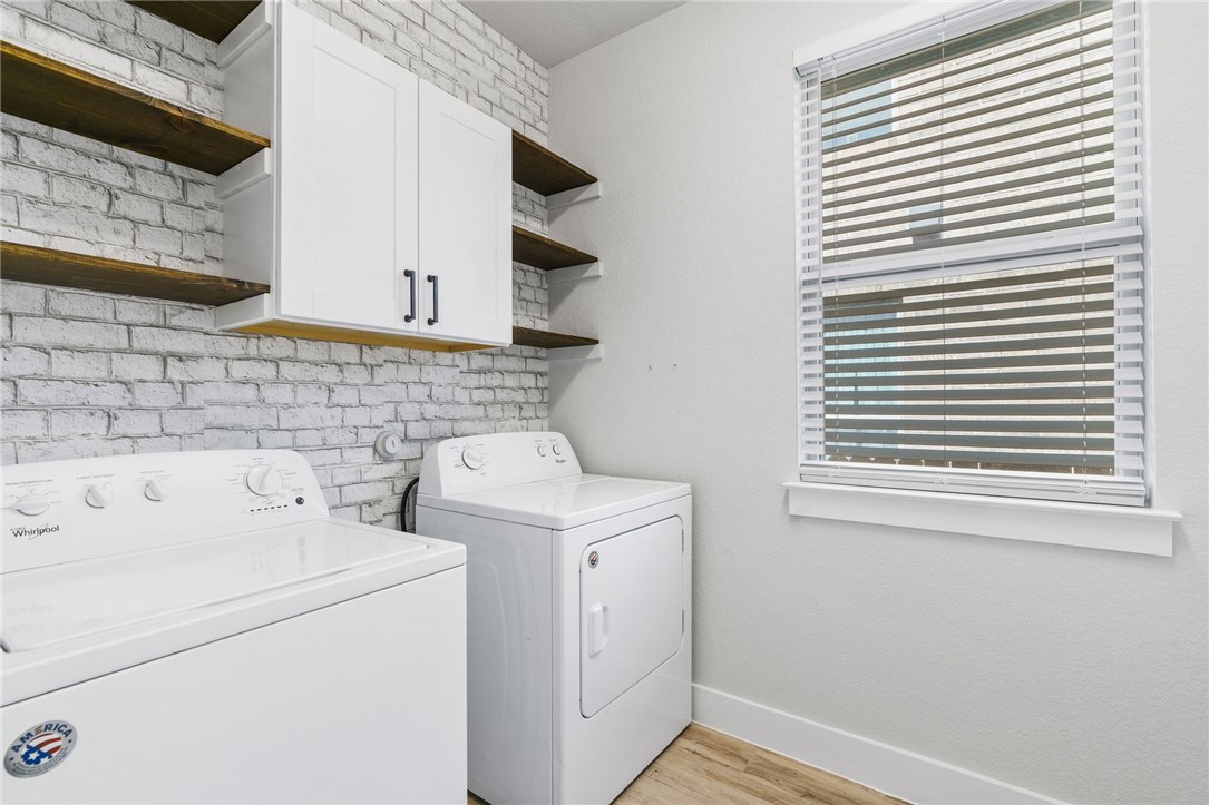 941 Del Raphael Drive Leander, TX 78641 - Photo 22 of 33 Spacious laundry with built-in shelving and cabinetry